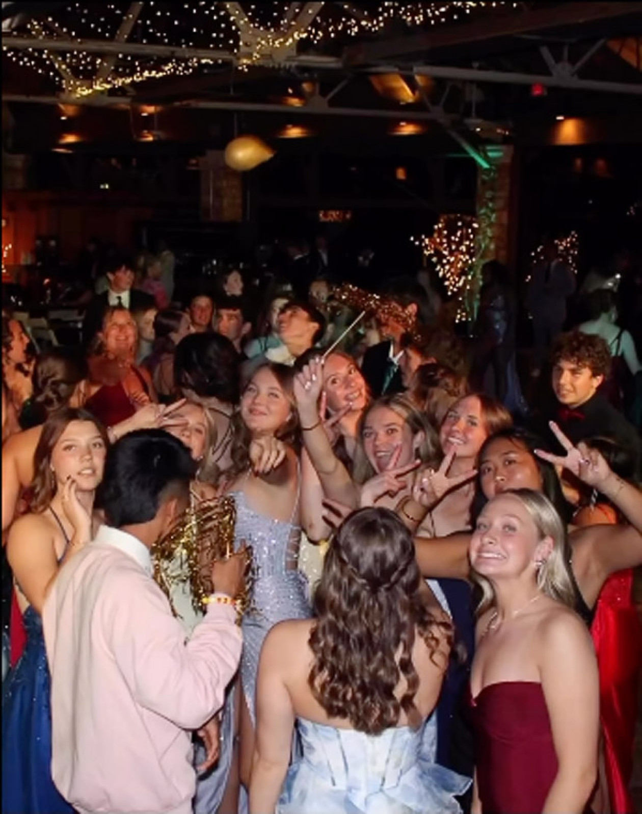 A screenshot showing students celebrating at a prom.