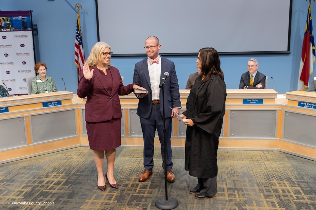 Dr. Reed swears in with her husband and Judge. Robin L. Merrell.