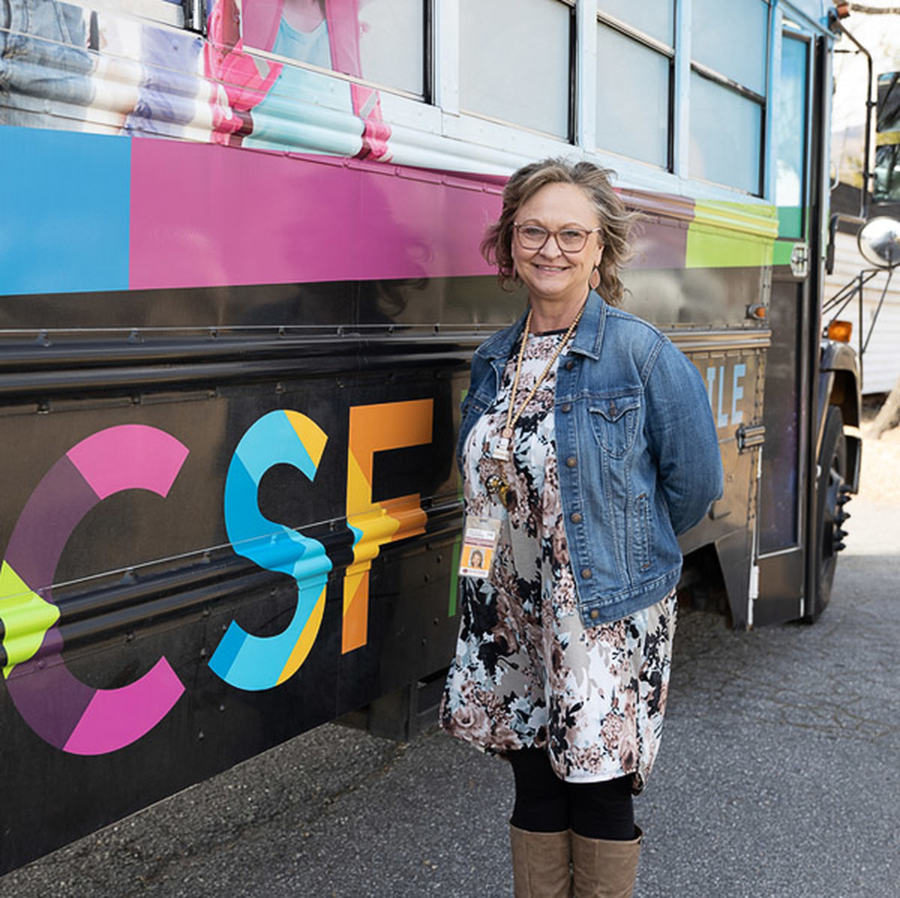 Pricilla Lunsford poses beside the Bookmobile.