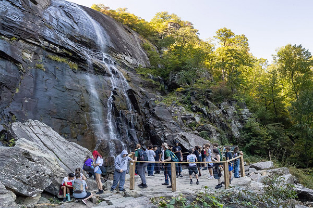 Reynolds Middle students gather at the viewing platform for Hickory Nut Falls.