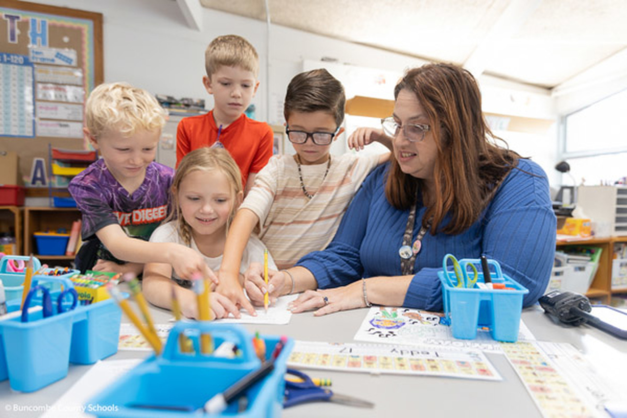 Heather Buckner leads for children in a lesson.