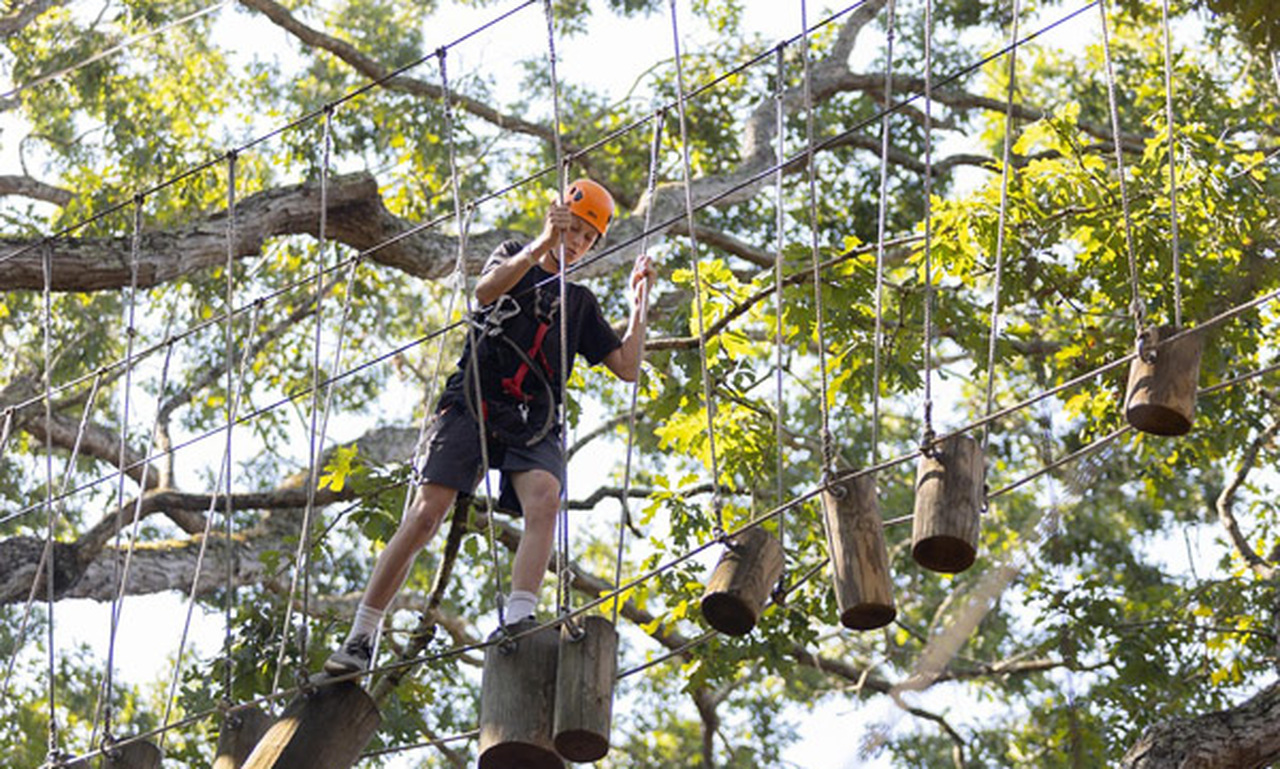 A BCCI student tackles the ropes course at Adventure Center of Asheville