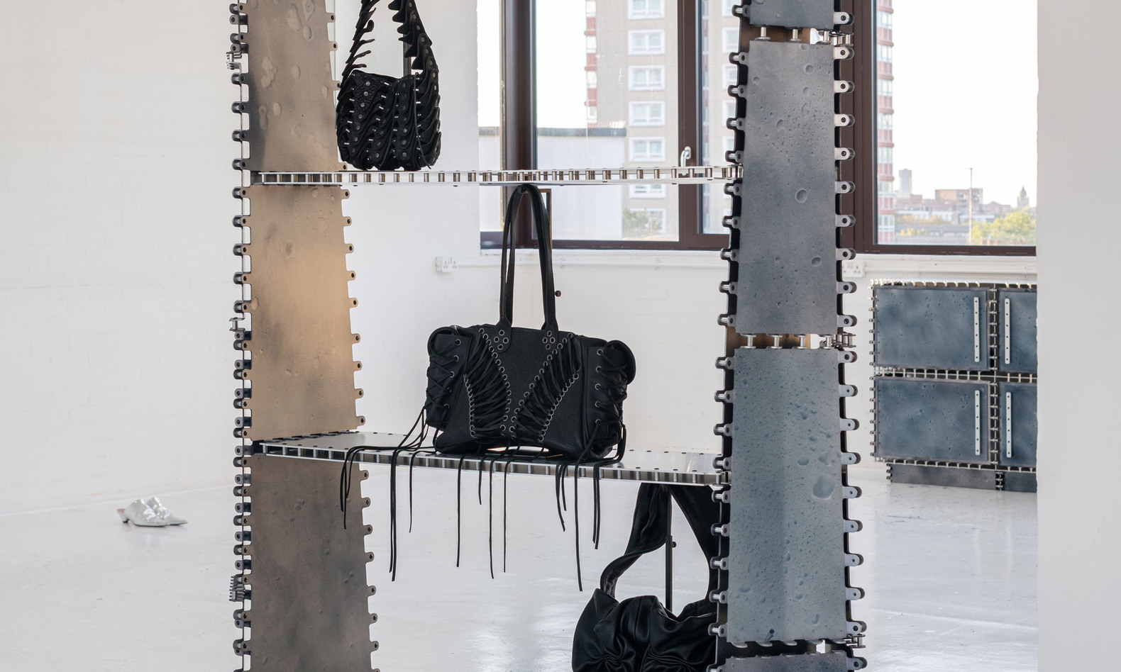 Tom Pearson unveils riveting aluminium furniture with droplet-like patterns