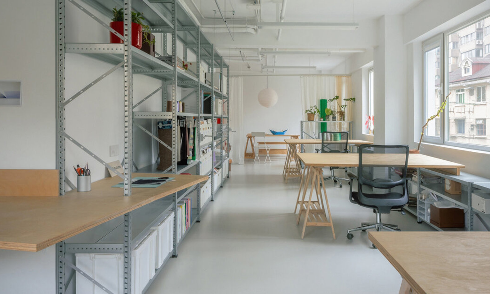 curved curtain and modular furniture reshape shanghai interior workshop and pop-up
