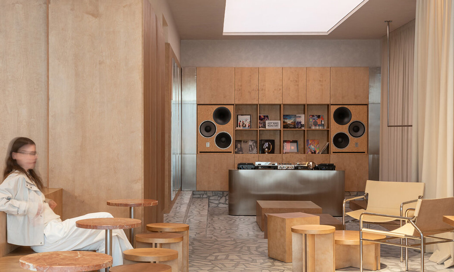 ukyo X blends café, listening bar, and co-working inside restored historic interior in romania