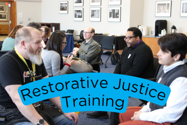 Participants talk with each other at a Restorative Justice Training
