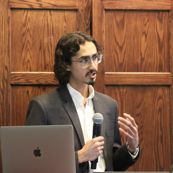Adam P. '27 giving a presentation