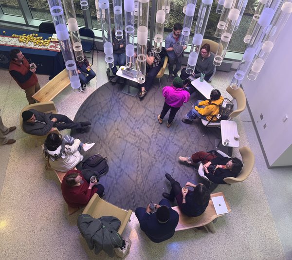 Ariel shot of people gathered in a circle for Grounds for Community programming