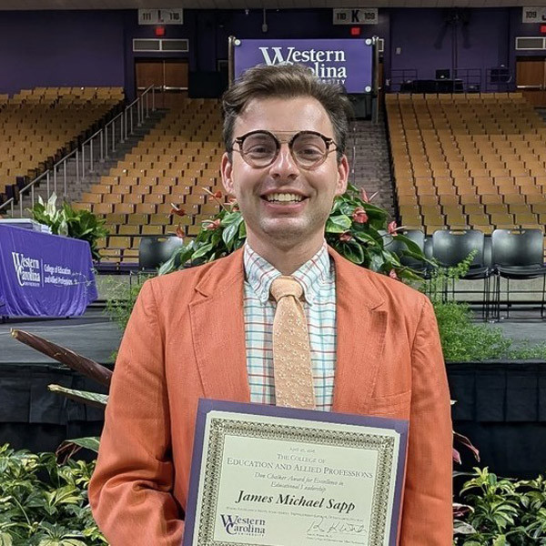 James Michael Sapp poses with a certificate.