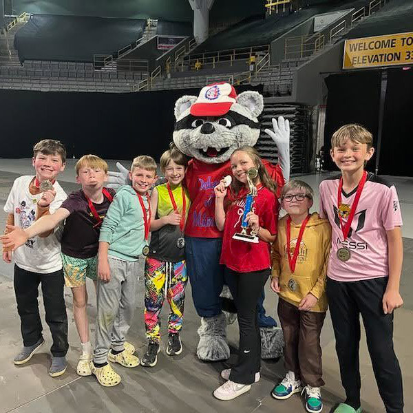 Fairview Elementary School’s Odyssey of the Mind team poses with a raccoon mascot.