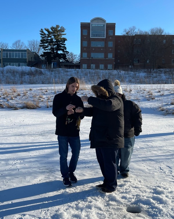 IPA student Ryan Soli catching a fish on Lyman Lakes assisted by Indigenous Faculty Roger Faust