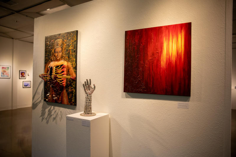 A painting, a sculpture, and a three-dimension art piece.